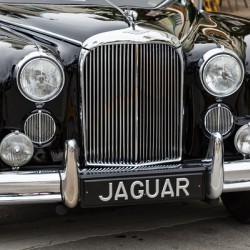 Front End of a Classic Old Black Jaguar